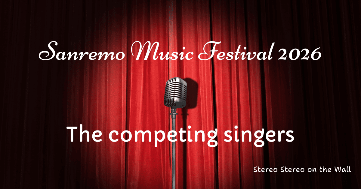 A closed red curtain with a microphone in front and the white writing above it: "Sanremo Festival 2026. The competing singers."