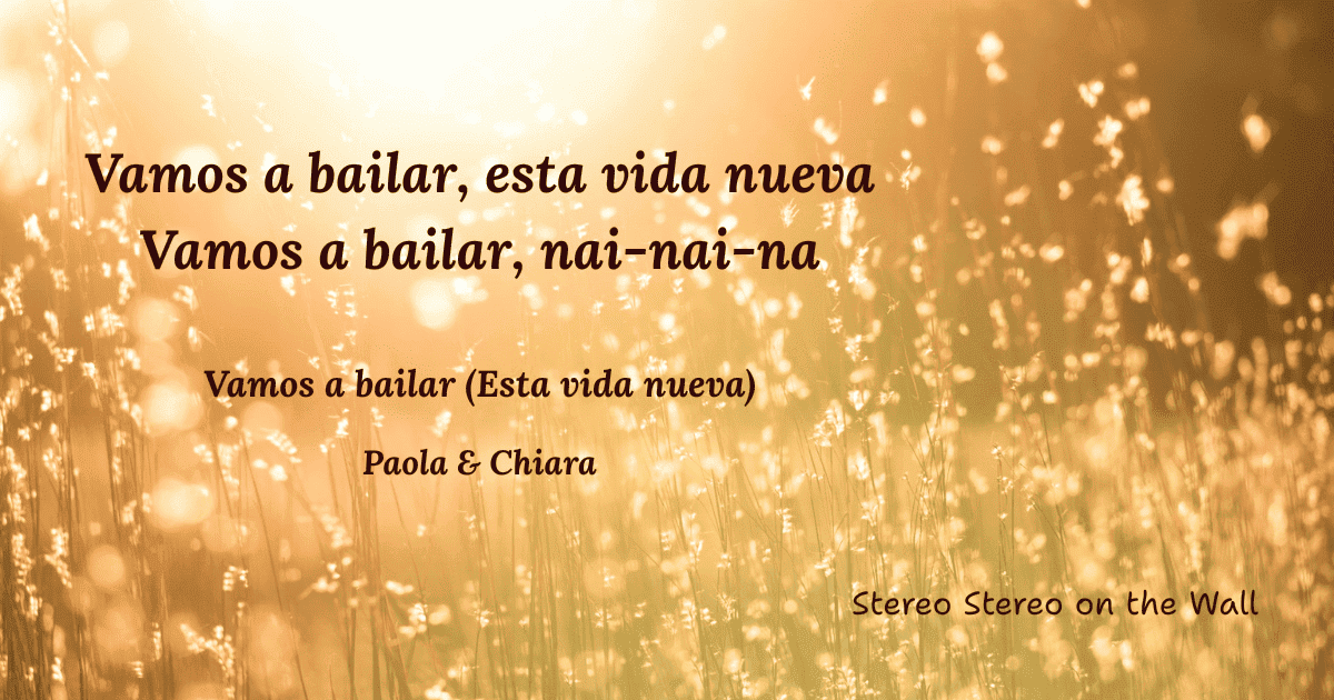 Gold background with the writing "Vamos a bailar esta vida nueva, vamos a bailar nai nai na", the chorus of the song "Vamos a bailar" by Italian singers Paola & Chiara.